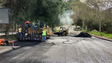 An Asphalt Spreader and a Skid Steer (Bobcat) work in Los Angeles!