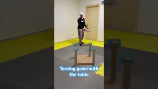 Tossing game for kids using the table #toddlers #kidsactivities #finemotorskills #kids
