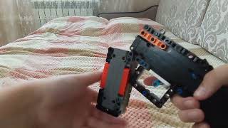 Lego shell enjecting 4 stud wide technick shotgun. (last video?)