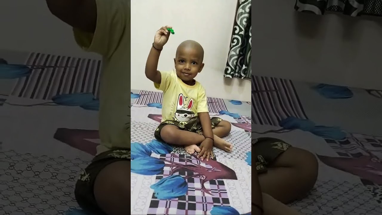 Vishnu Showing his books and toys.....😆😆😆