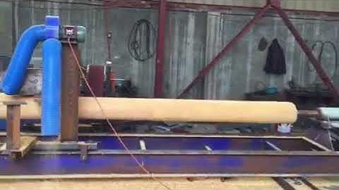 Log turning lathe for log cabins and wood construction