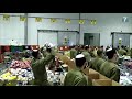 IDF soldiers sing 'Ani Maamin' while preparing packages for the elderly