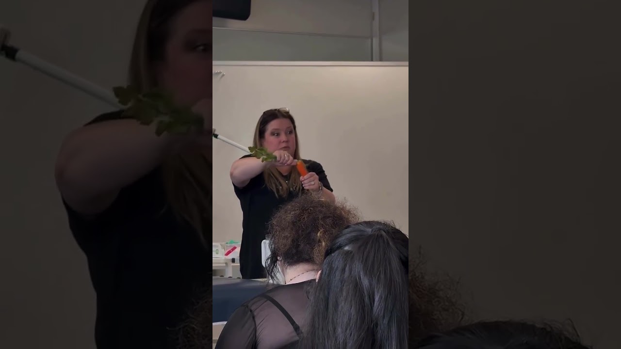 Wait… why is she using a carrot? Wait… why is she using a carrot?
