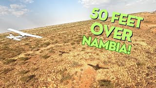 V Tail Bonanza chases a Cessna 210 fly low level across Namibia.
