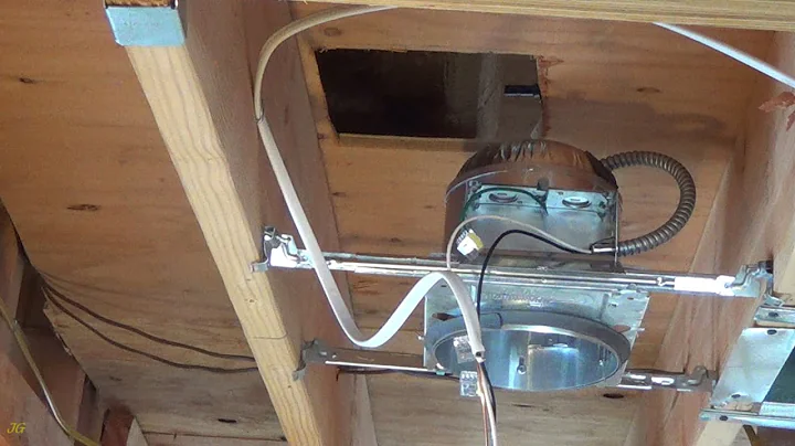 Commercial Electric 6 inch recessed light installation in opened ceiling.