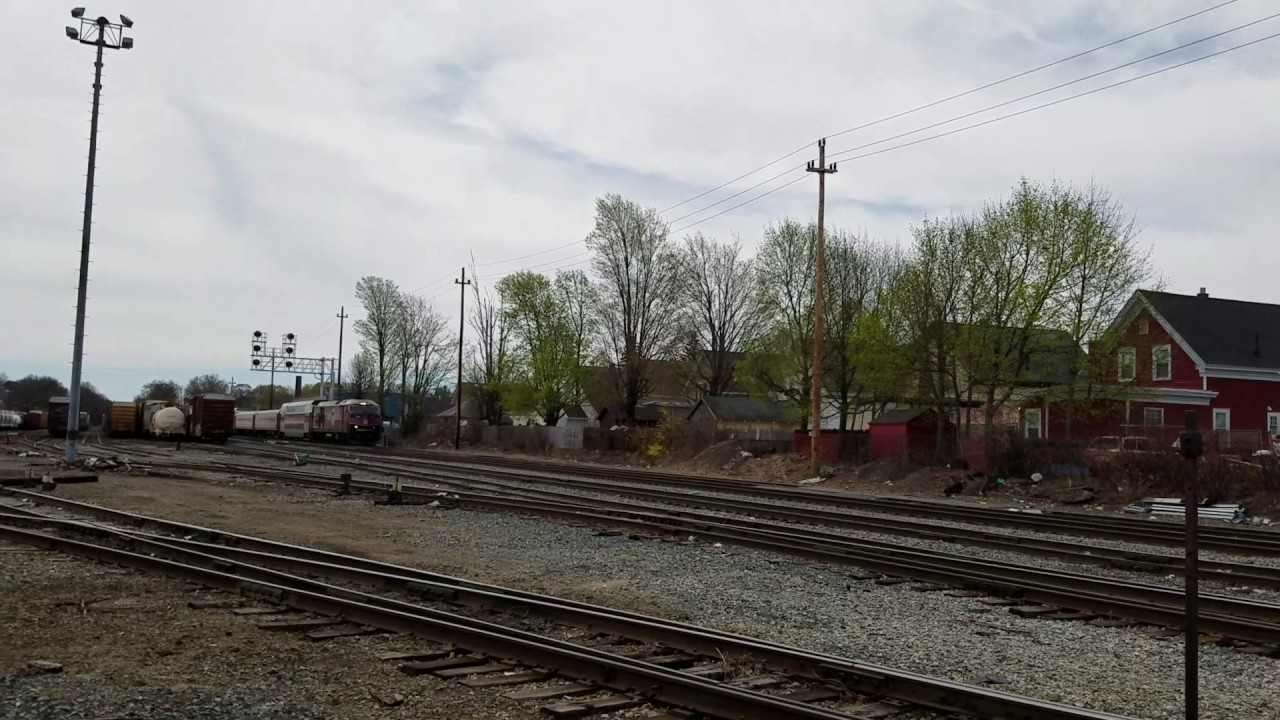 MBTA Train Going Over Railroad Crossing By Lawrence Station In Lawrence mbta-train-going-over-railroad-crossing-by-lawrence-station-in-lawrence