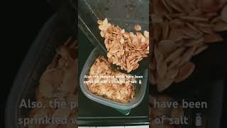 Aaron roasts pumpkin seeds from the 2 pumpkins he had carved