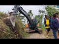 Excavator Rainy Day Work Cutting Out Hillside-Widening Mountain Road