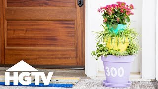 Add color and curb appeal to your porch with this house number
planter, featuring three stacked terra-cotta pots.get step-by-step
instructions at hgtv.com: h...