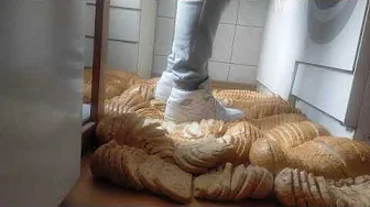 White AJ1 Mid walking on bread carpet