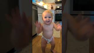 Toddler Walks, Claps, and Dances to "If You're Happy and You Know It"