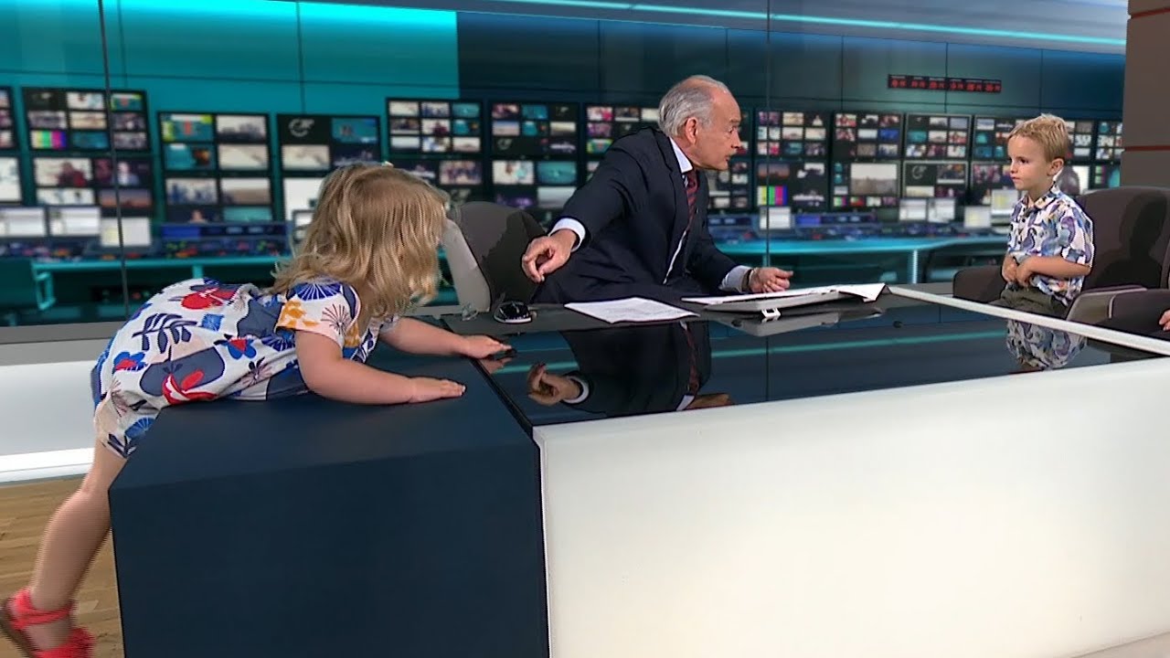 Toddler Climbs On Alastair Stewart S Desk During Itv News Video