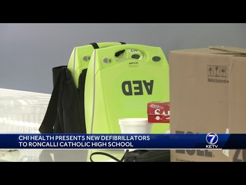 Staying proactive: CHI Health presents new AEDs to Roncalli Catholic High School