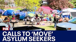 Neighbors call to 'move' asylum seekers out of Seattle park, into shelter | FOX 13 News