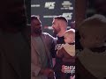 Uriah hall and chris weidman hug after leg break at ufc 261