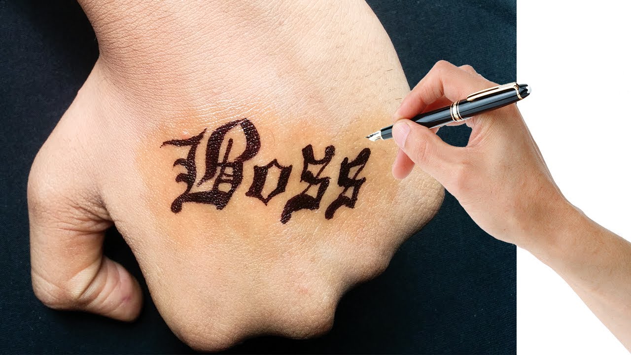 Tattoo of the word boss located on the finger