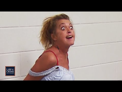 Drunk woman goes nuts on other people locked up (jail)