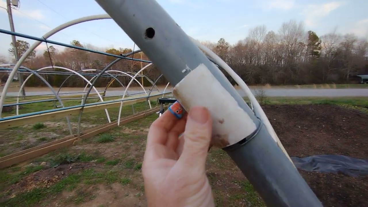 Build a CHEAP greenhouse, hoop house or high tunnel with used trampoline frames and PVC.