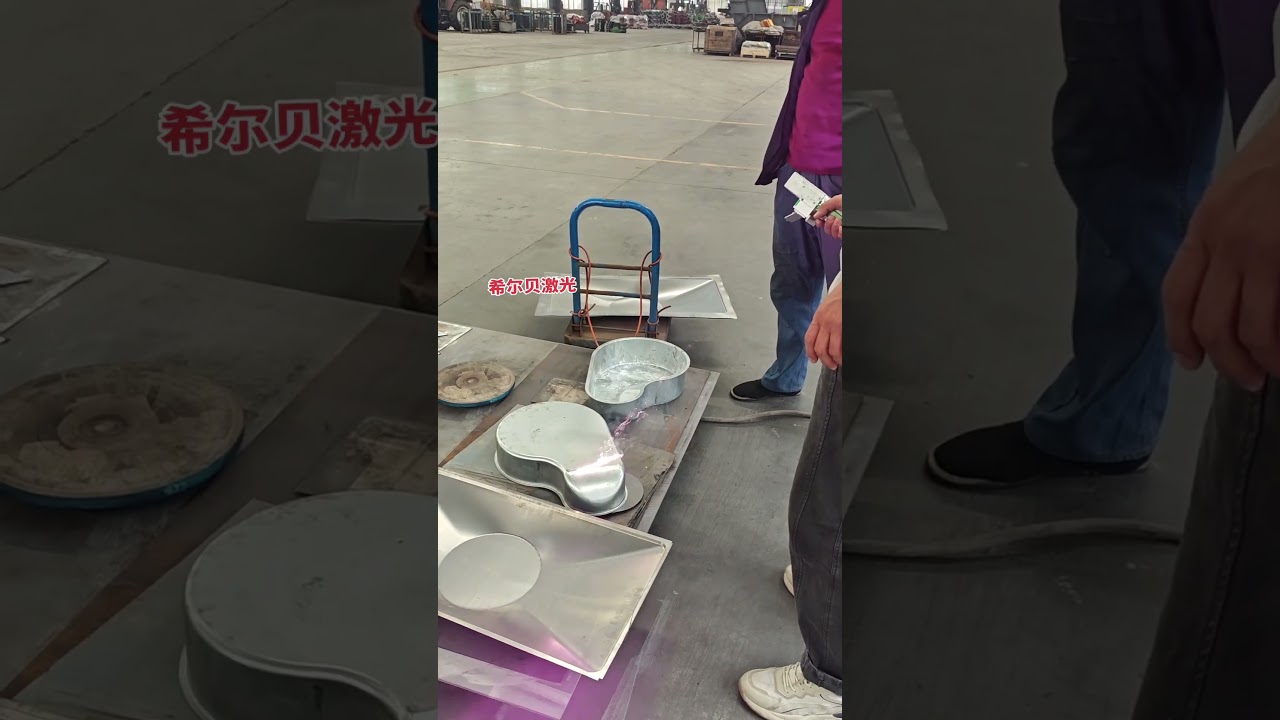 Laser removal of oil stains from sheet metal surfaces 