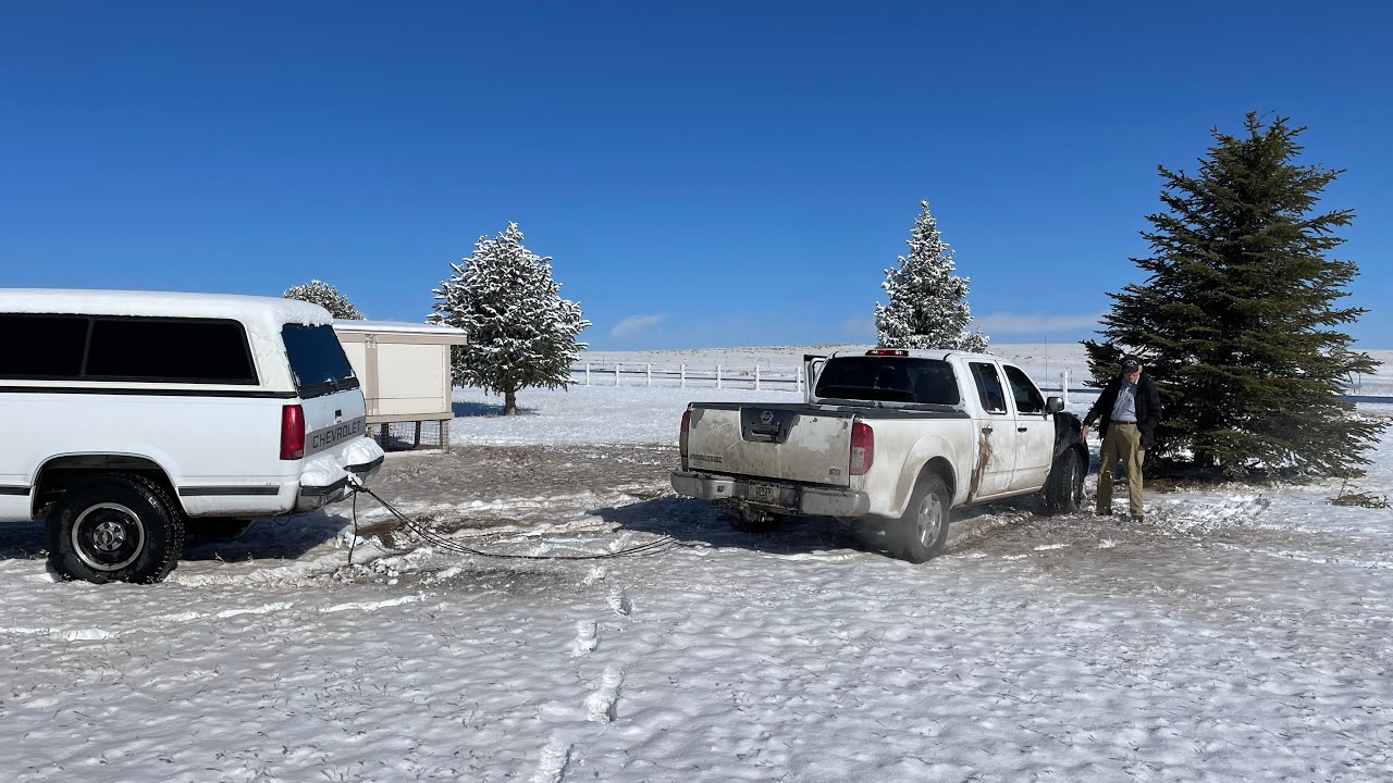 Heavy Chevy in the Rockies to the Rescue. Snow/ice spin out & recovery.