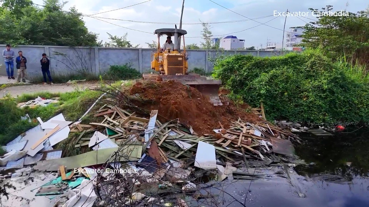 Old Video But I Like This Action Bulldozer D31P Pushing Clearing Trash And Truck Unload Of Soil 100%