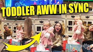 Toddler Girl Open Christmas Present and “Aww” With Family Same Time