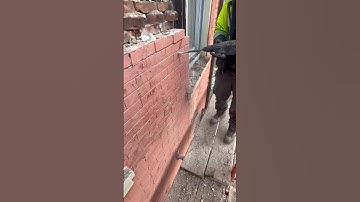 Chisel the brick loose with the chipping hammer until they can be removed by hand#work #construction