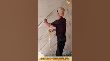 Skilled Worker Revealing Geometric Decorative Wall Patterns with Precision Tape Removal #walldecor