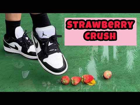 Crushing strawberries in the park