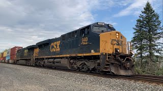 A CSX Priority train flies by heading west
