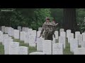 Flags placed on headstones at Arlington National Ceremony