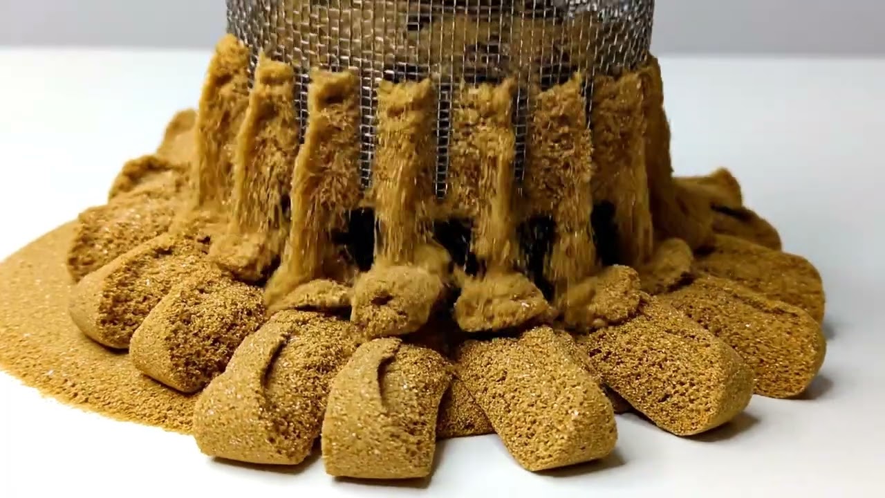 AI ASMR : Golden kinetic sand being squeezed through a metal mesh
