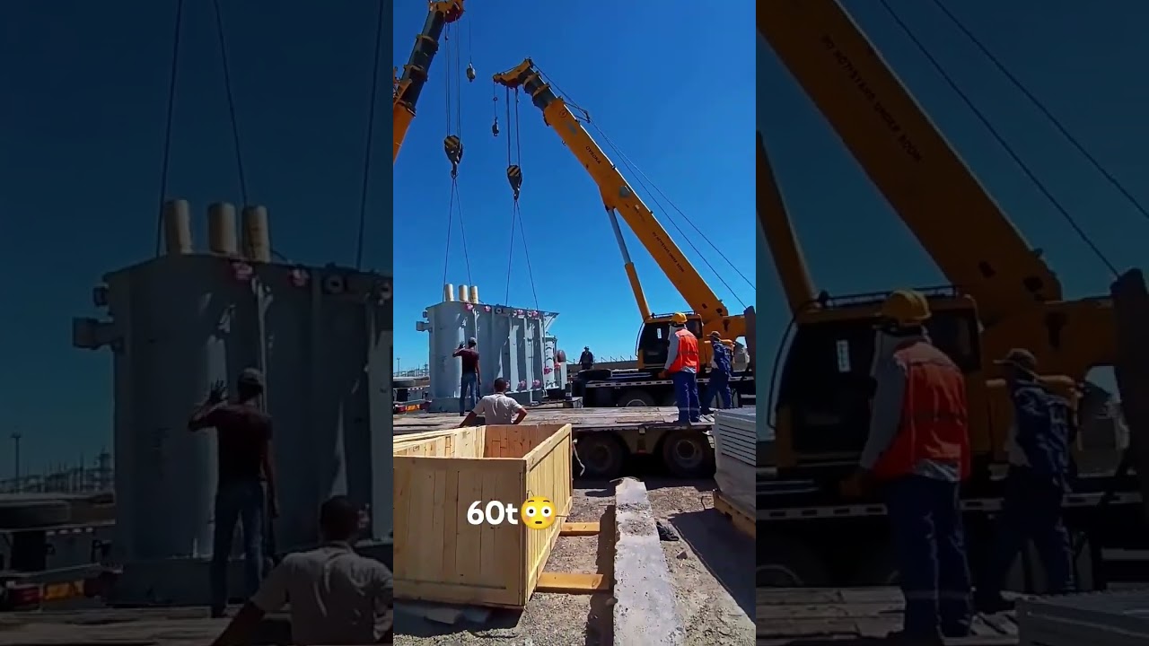 Два крана вместе поднимают 60-тонный трансформатор.  