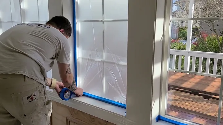 Masking Windows in Preparation for Spraying Interior Trim
