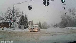 Camry tries to run red light in the snow