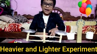 Heavier and lighter experiment with seesaw balance