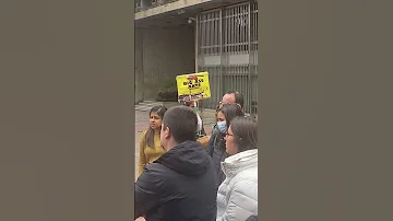 Lady Holding a “Big Ass Ants” Sign Interrupts a City History Tour