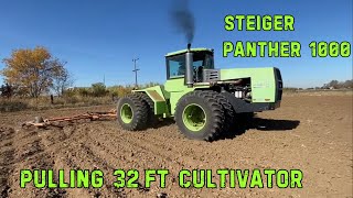 Steiger Panther 1000 making easy work pulling a 32 FT cultivator