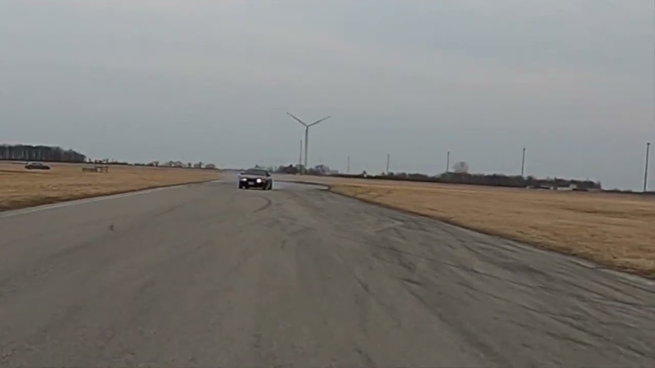 BMW E39 M5 drifting on Mustang chase cam at Toronto Motorsports Park