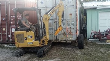 Moving 40ft container across the yard the easy way... Pushed with the mini-ex and a set of wheels
