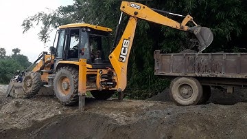 JCB Backhoe Loader Making Drain and Loading Soil in Tractor - JCB Working For Road Construction