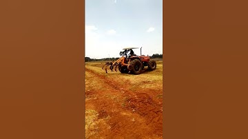 massey ploughing with a chisel plough