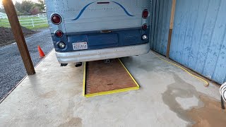 Covered bus parking with service pit