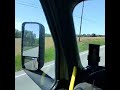 POV Inside of a fully loaded Big Rig Semi Truck 18 Wheeler racing down an old country road. (1)