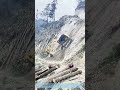 Defying Gravity's Pull: How a Mini-Excavator Safely Descends a Slope