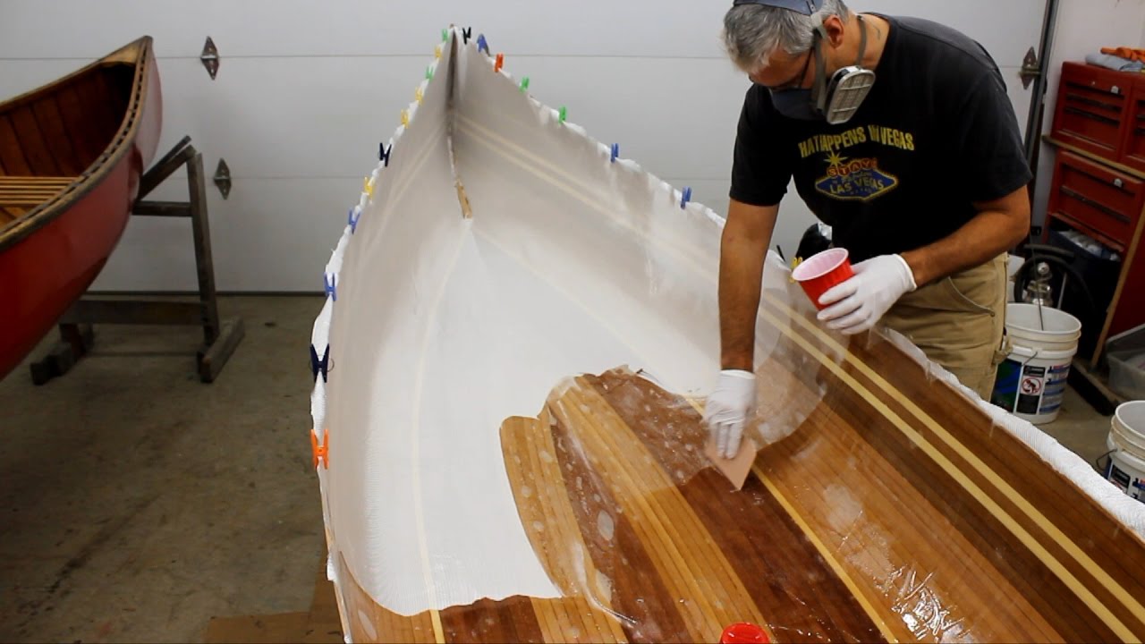 Fiberglassing a cedar strip canoe - YouTube