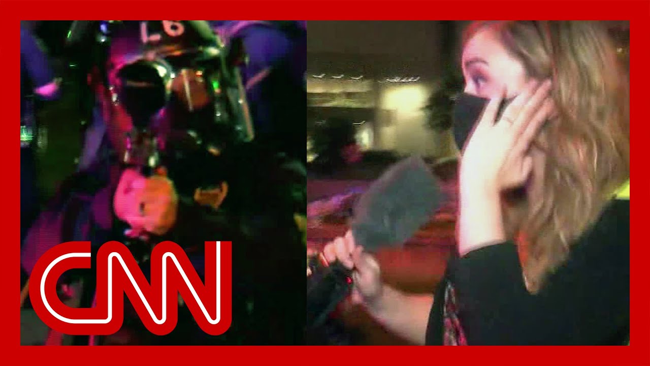 Officer fires pepper balls at reporter