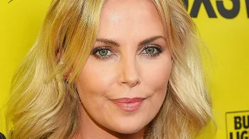 When did Charlize Theron leave South Africa?