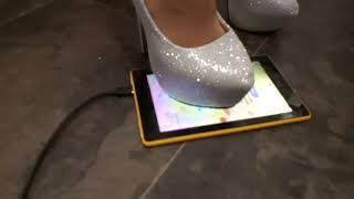 My new spike heels playing with a tablet