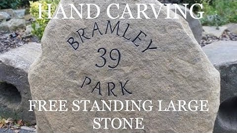 HAND CARVING a free standing natural faced house sign - stone lettering. - stone letter carving